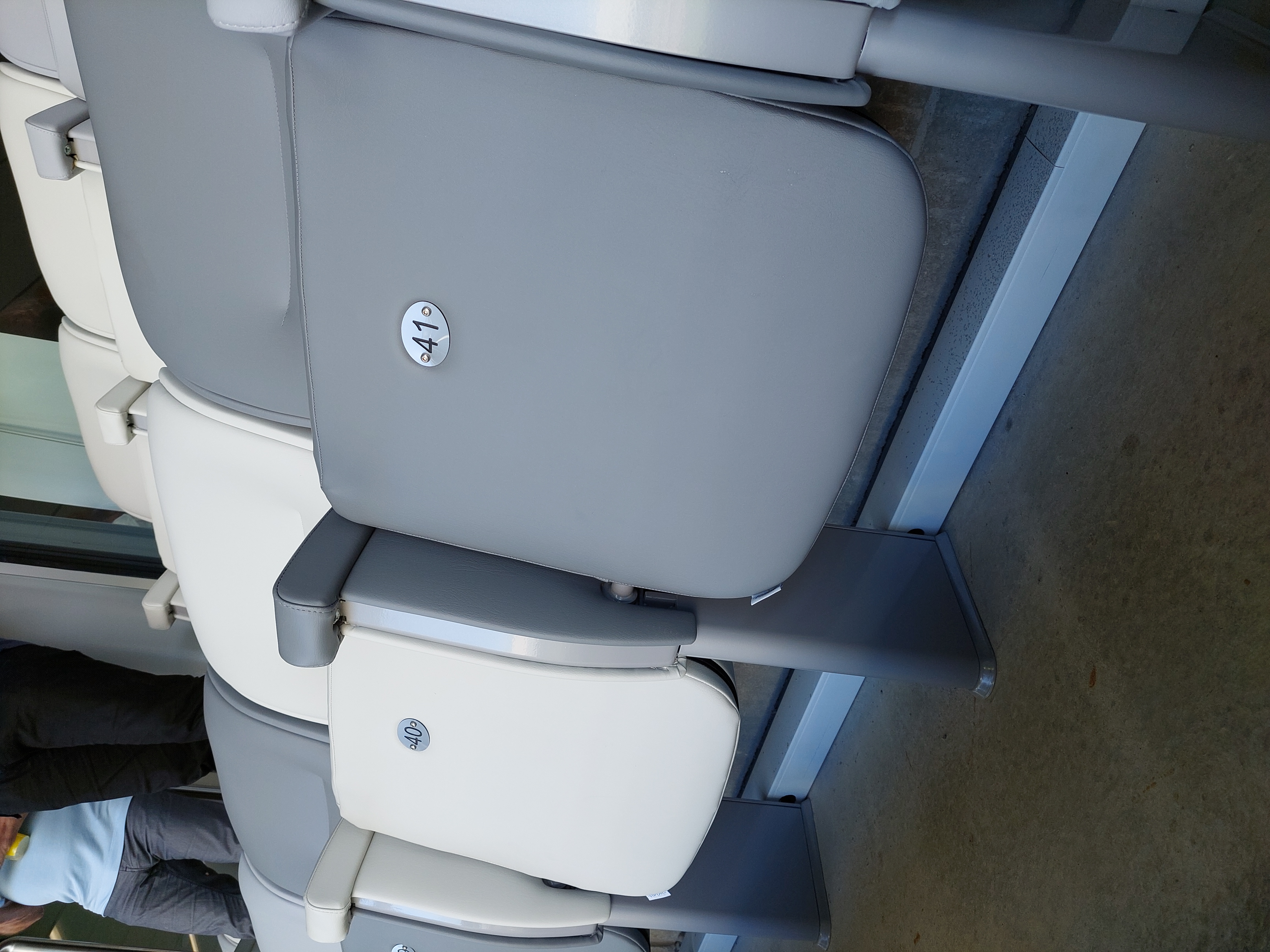 cushion,home decor,adult,male,man,person,chair,furniture,car,jeans